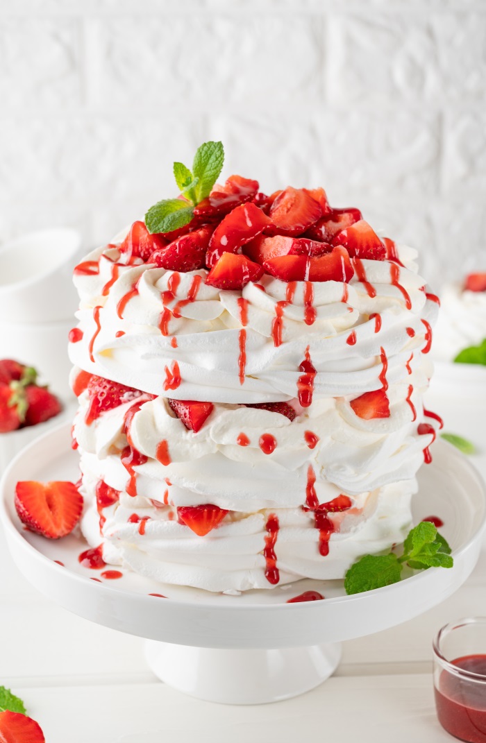 Strawberry Shortcake covered with whipped cream and strawberry topping 