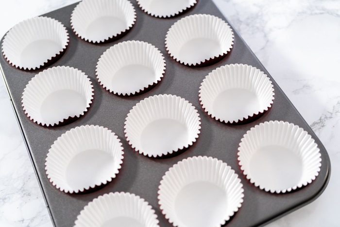 line a muffin tray with paper liners