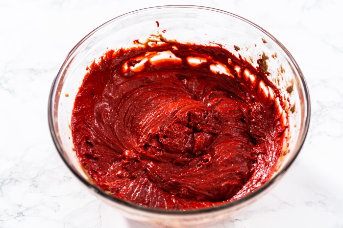 the mixture is now bright red ready for baking red-velvet-cupcakes