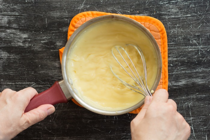 Stir until fully melted and glossy to get a thick creamy custard