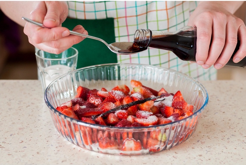 place the strawberries, sugar and vanilla in a small baking dish